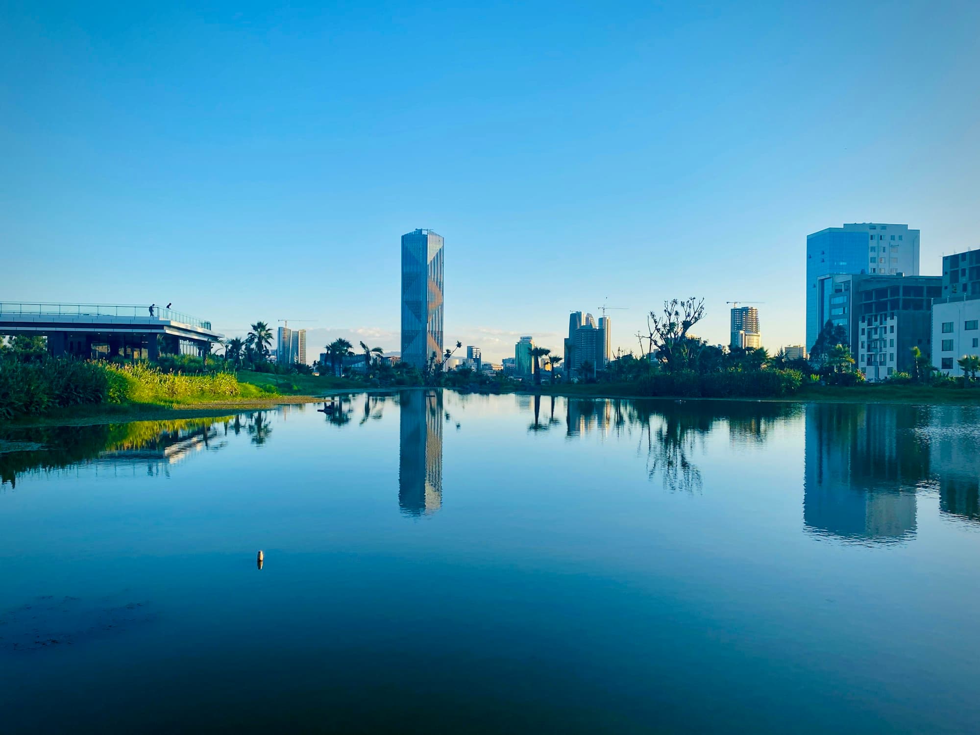 Addis Ababa skyline reflected in a still lake under a clear sky