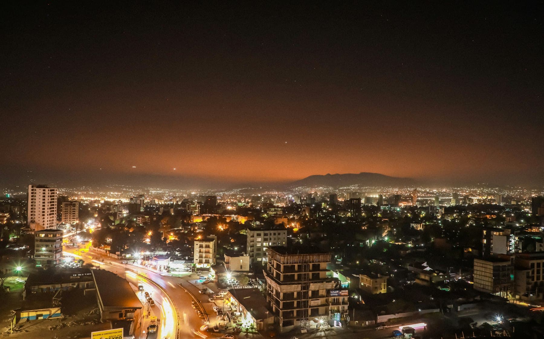 Addis Ababa at night under an amber sky