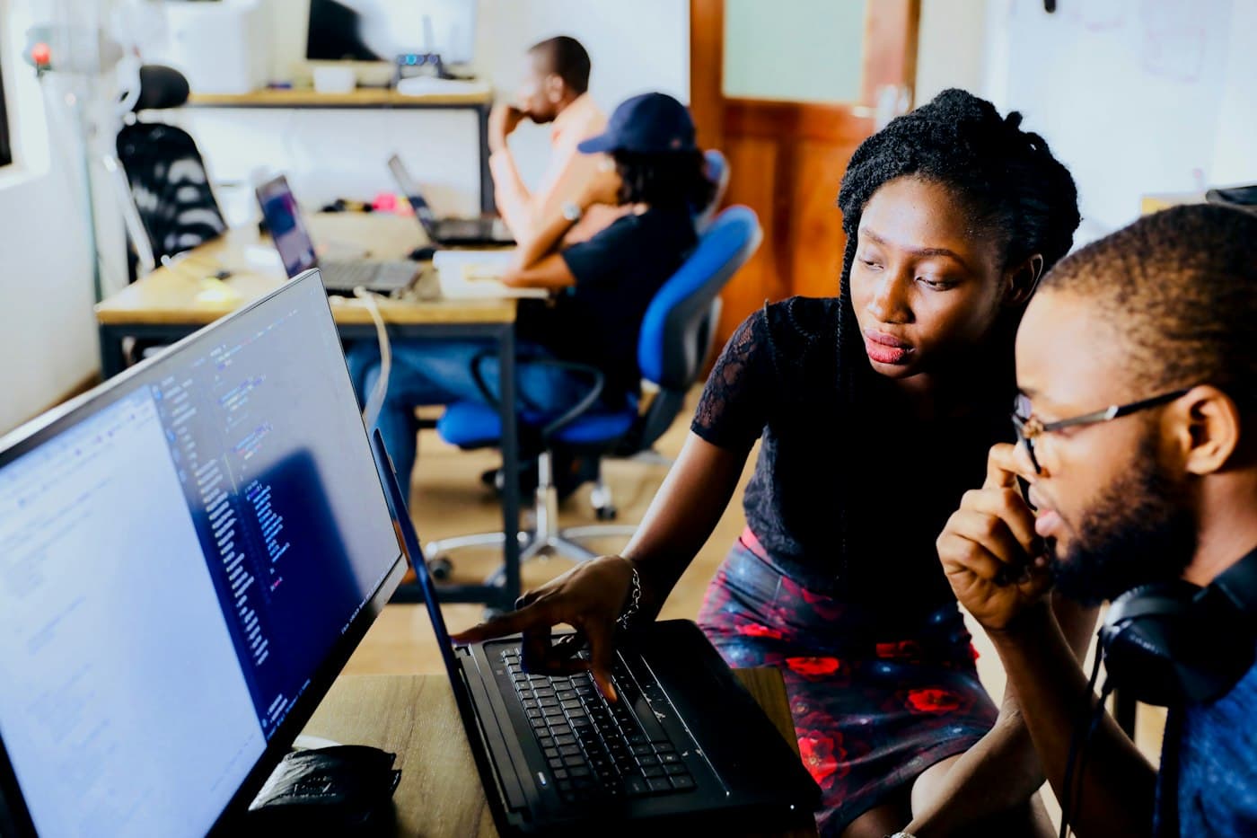 Engineers reviewing code together on a shared screen