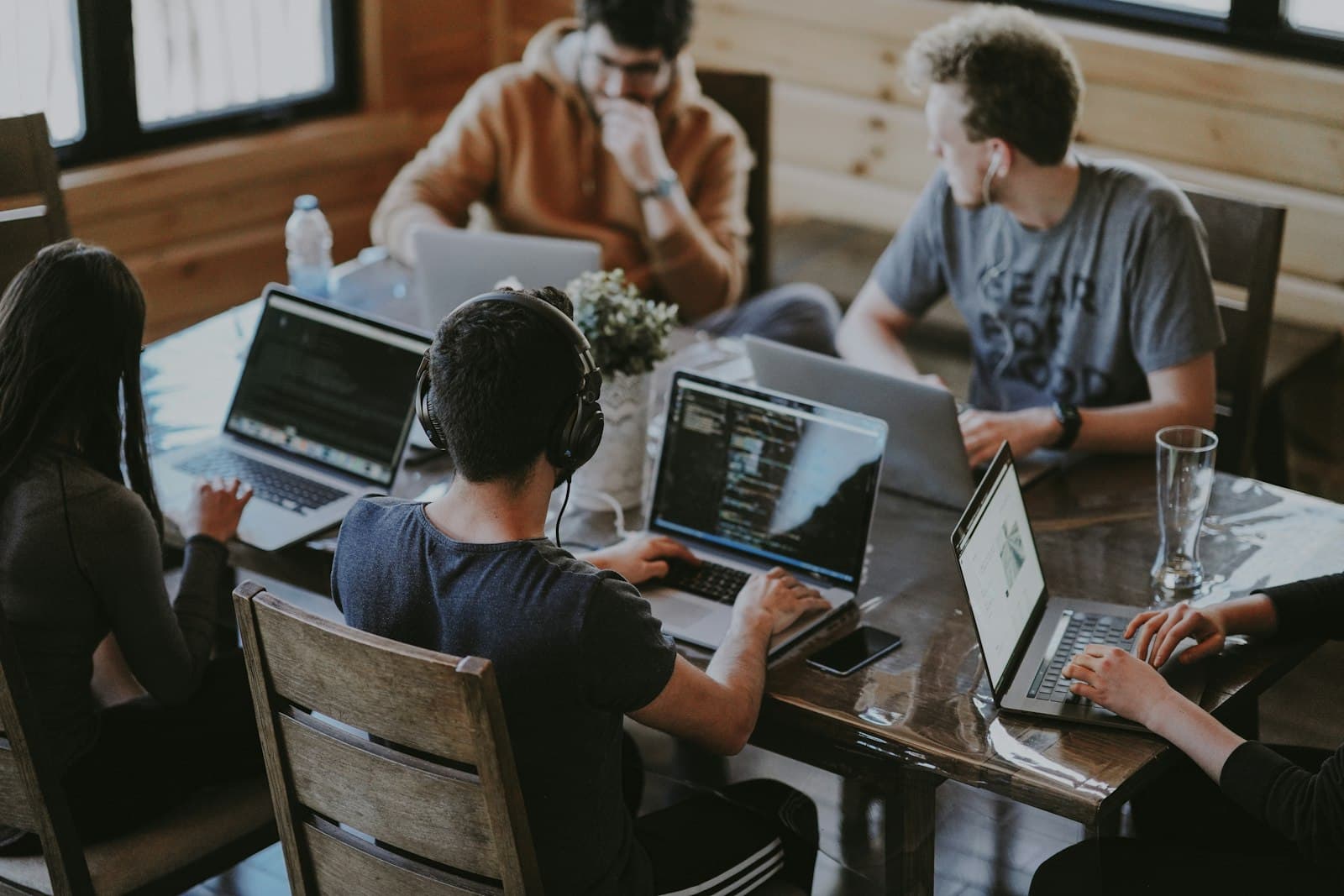 A product team working through a plan around a shared table